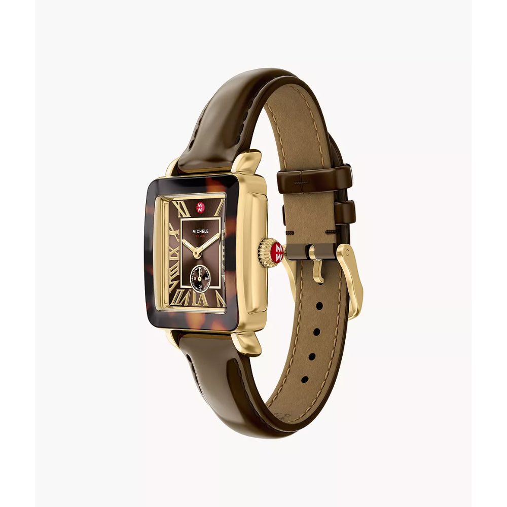 A rectangular watch with a brown leather strap, gold-tone case, and a dark tortoiseshell-patterned bezel.