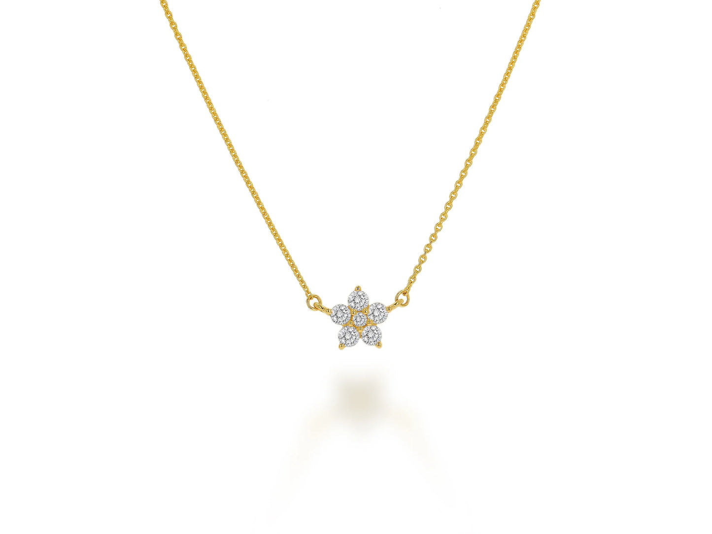 gold necklace with diamond center pendant on white background