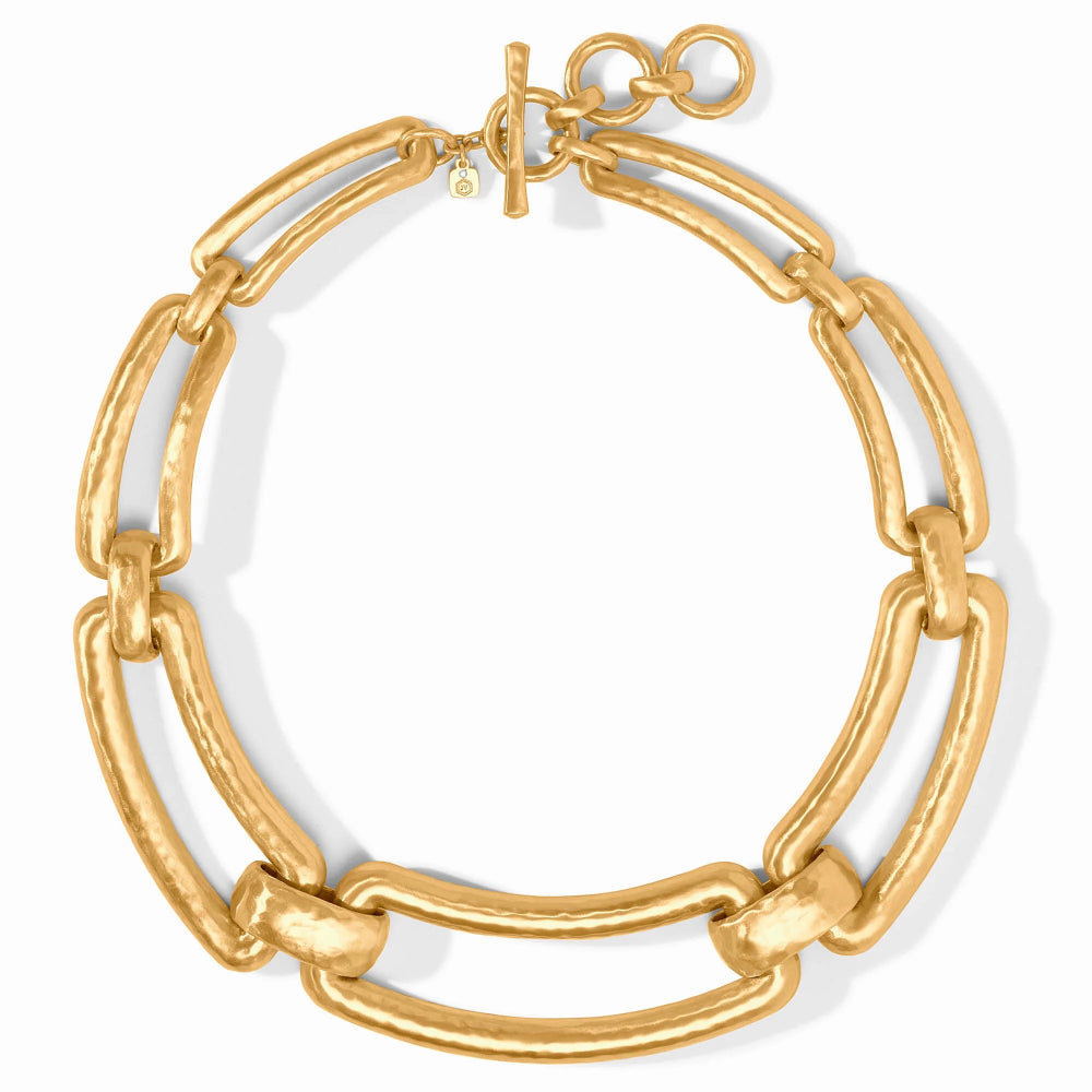 A chunky gold-tone chain link bracelet with a toggle clasp, displayed on a clean white background.