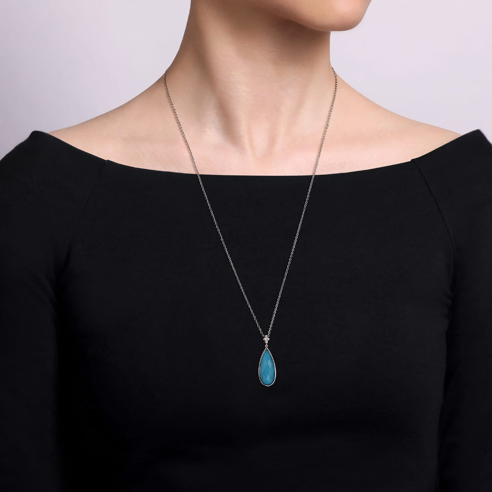Woman wearing turquoise necklace