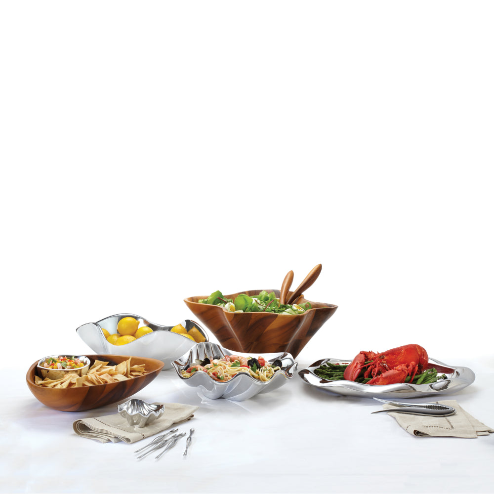 Assorted food items including a lobster, salad, and chips on a white background with Sea Shell Dip Bowl