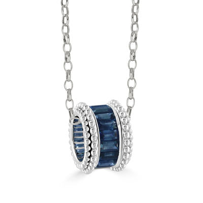 silver tone necklace with blue stones center and beaded sides on a link chain on a white background
