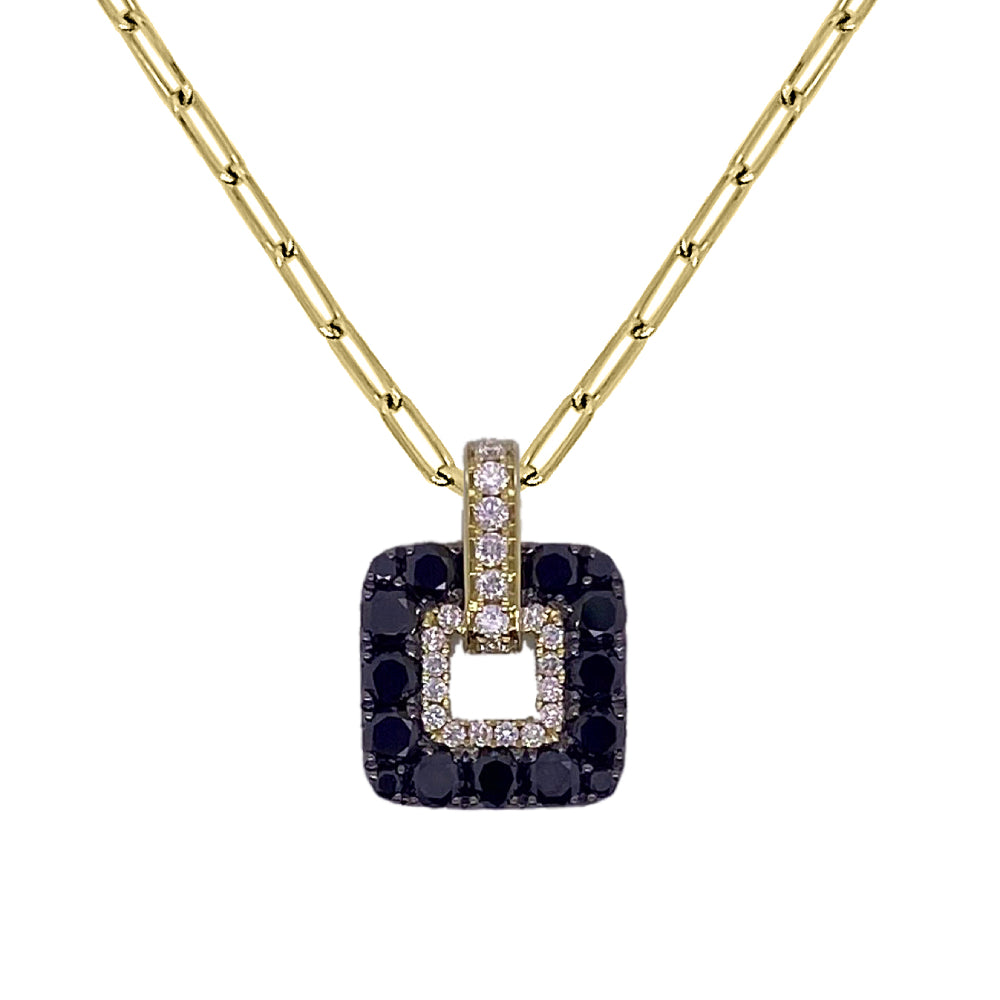 Gold necklace with a square pendant featuring black and white diamond on a white background