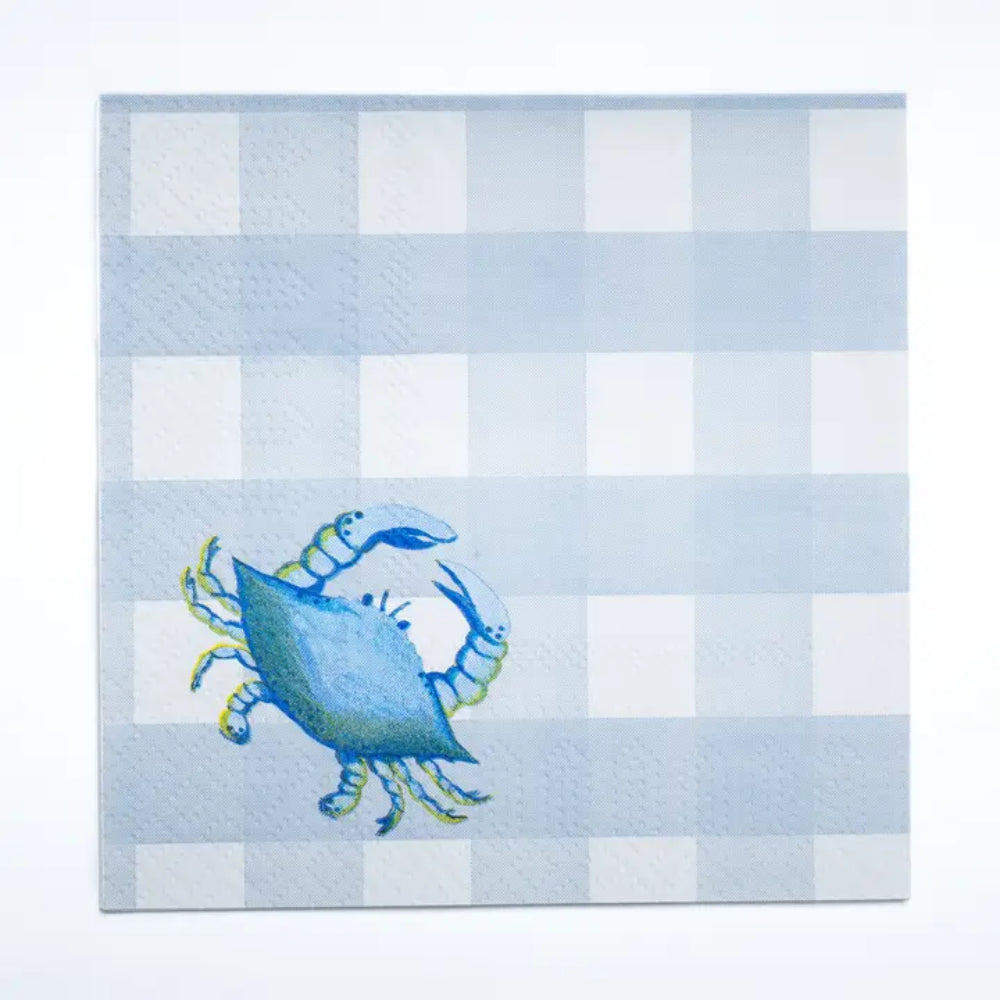 A square paper napkin with a light blue and white gingham check pattern and a blue crab illustration in the lower left corner, shown on a plain white background.