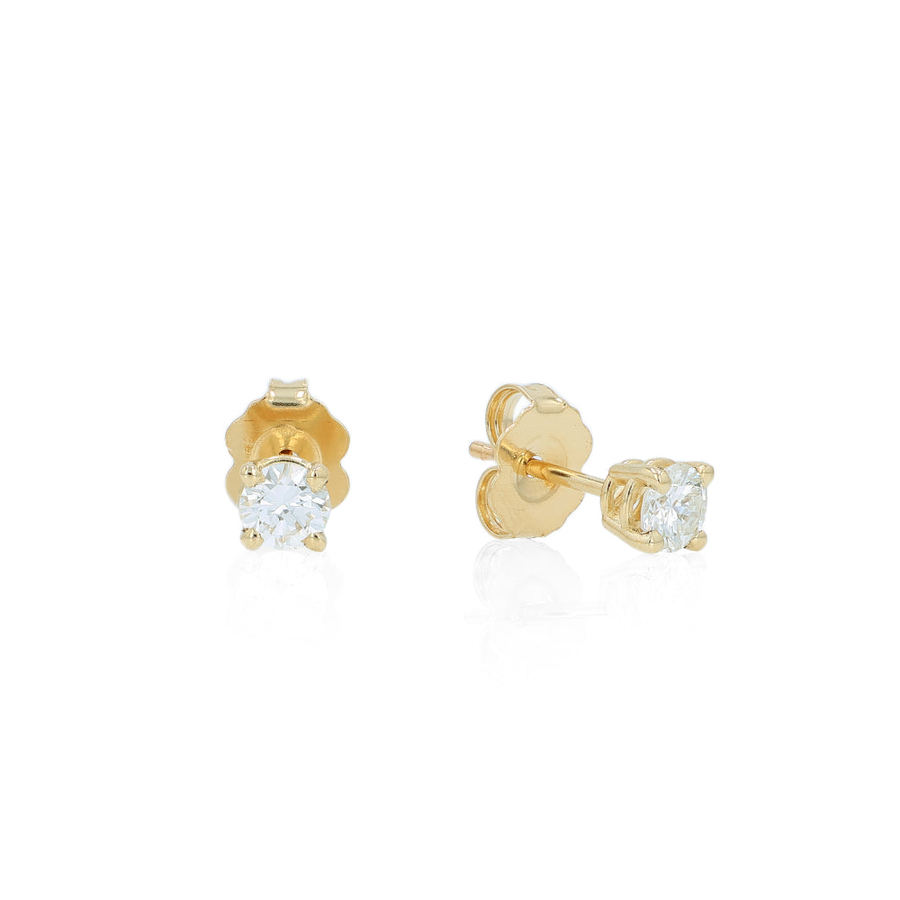 Yellow gold 4 prong diamond stud earrings on a white background