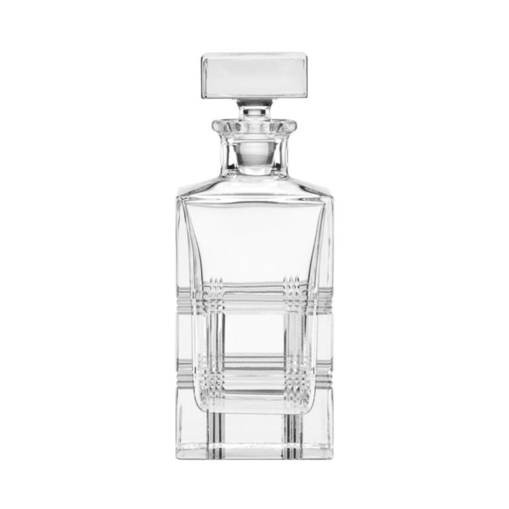 Clear glass decanter with decorative pattern on a white background