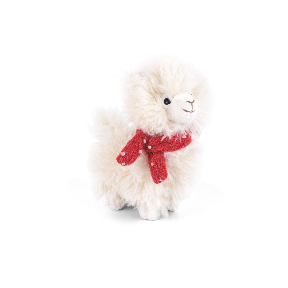 A small fluffy white alpaca plush toy wearing a red knitted scarf with white polka dots, set against a plain white background.