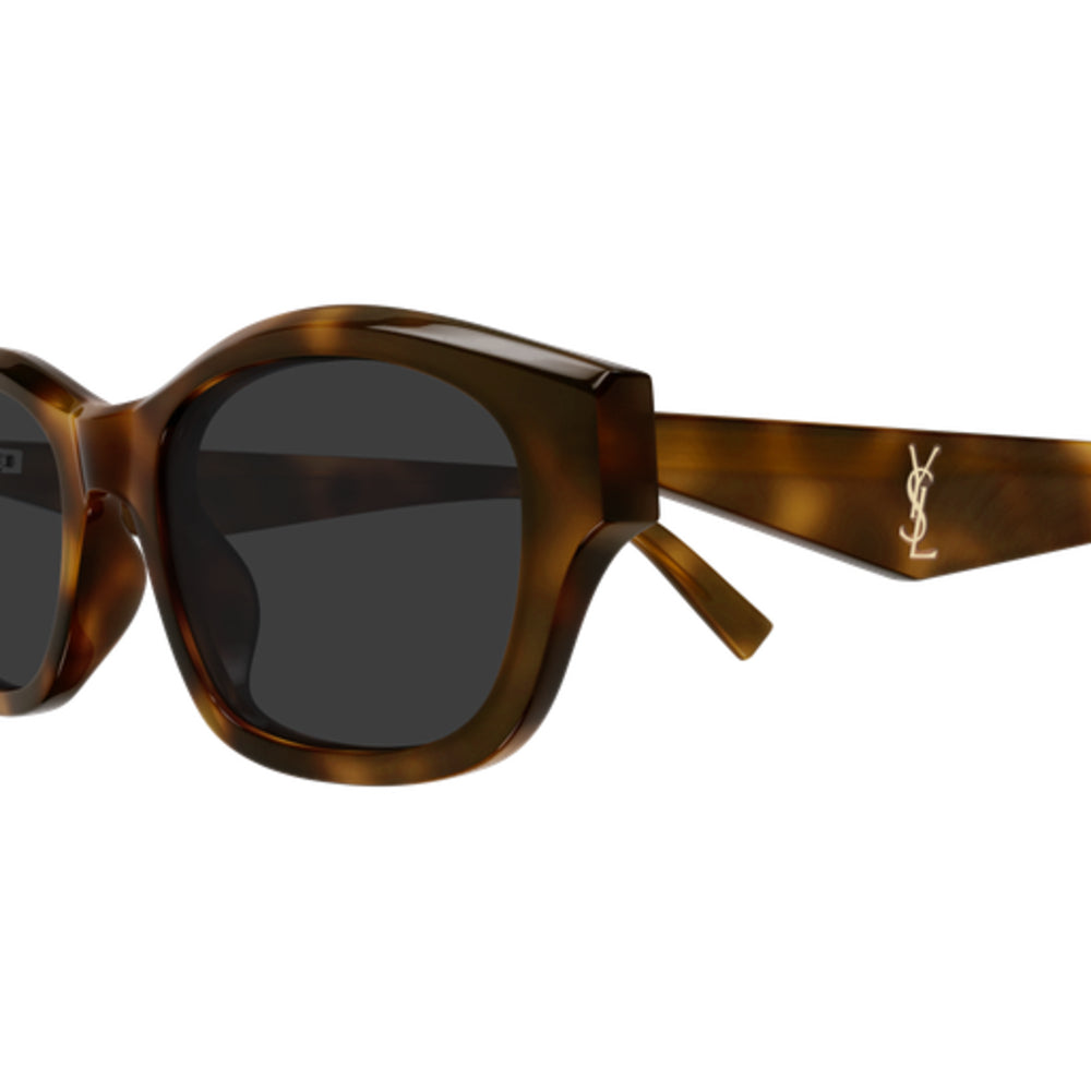 Close-up of a pair of sunglasses with a brown tortoiseshell acetate frame and dark gray lenses, featuring the gold-toned YSL logo on the temple arm, set against a plain white background.