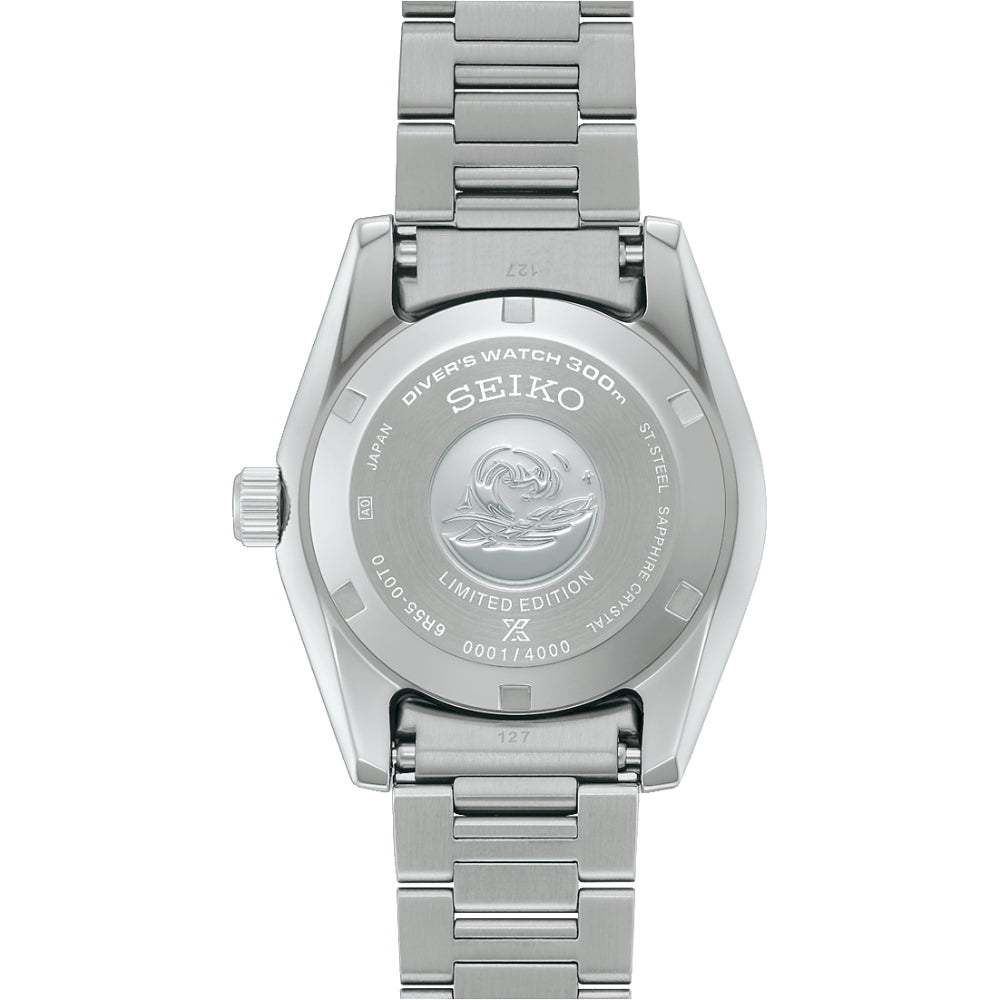 Silver Seiko watch with detailed case back on a white background