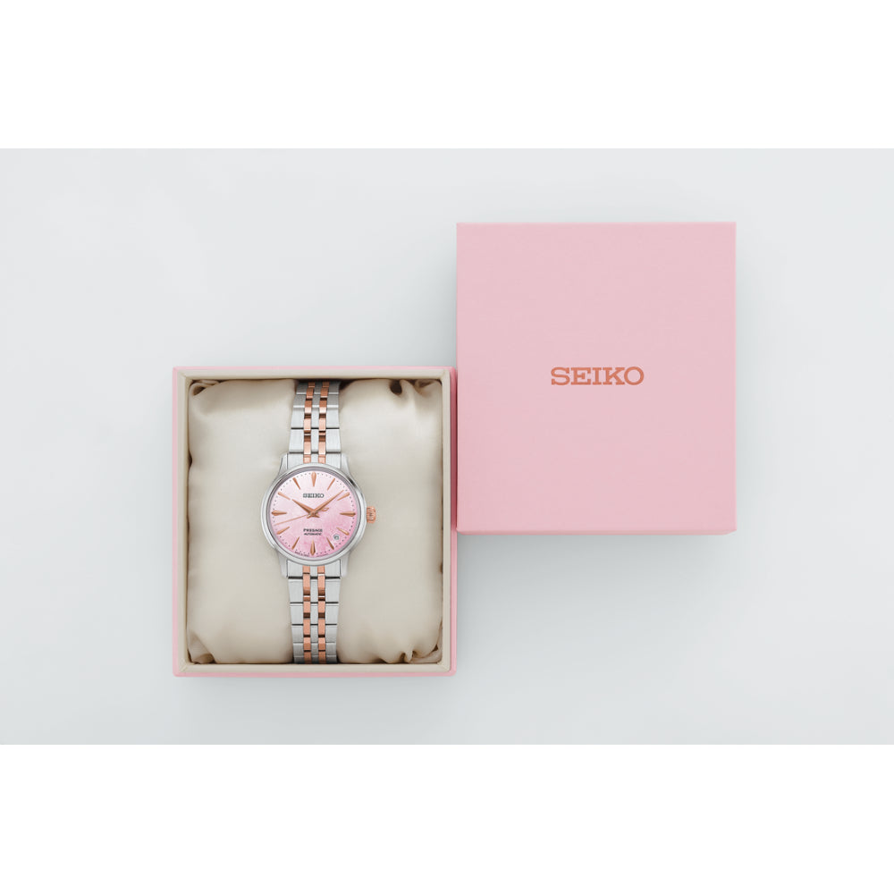 Two-Tone Watch with Pink Dial on a White Background
