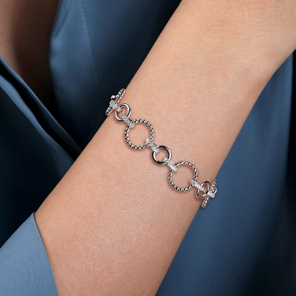 Person wearing Silver and White Sapphire tennis link bracelet