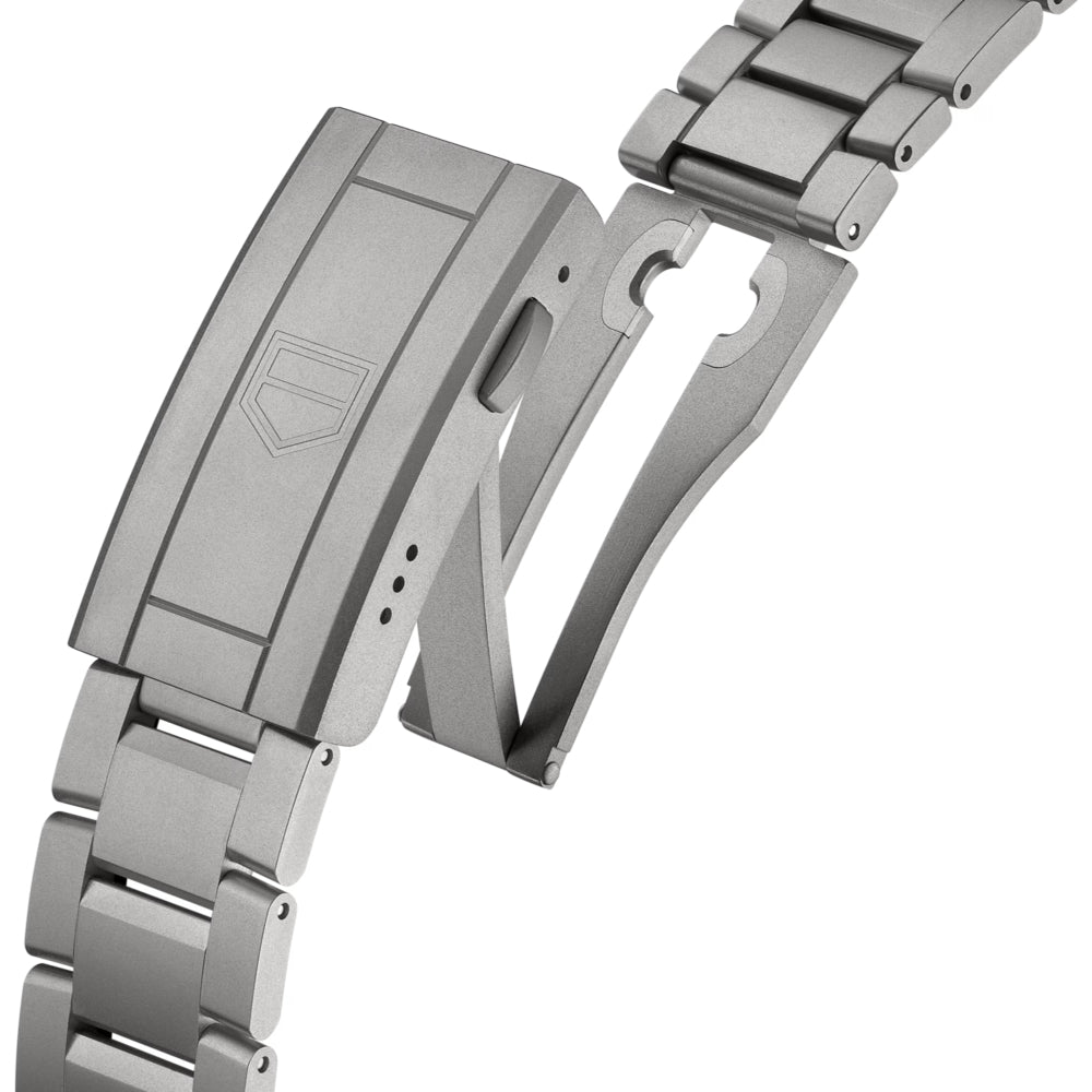 Close-up of a silver watch strap on a white background