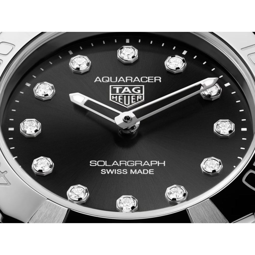 Tag Heuer Aquaracer watch with black dial and diamond-like markers