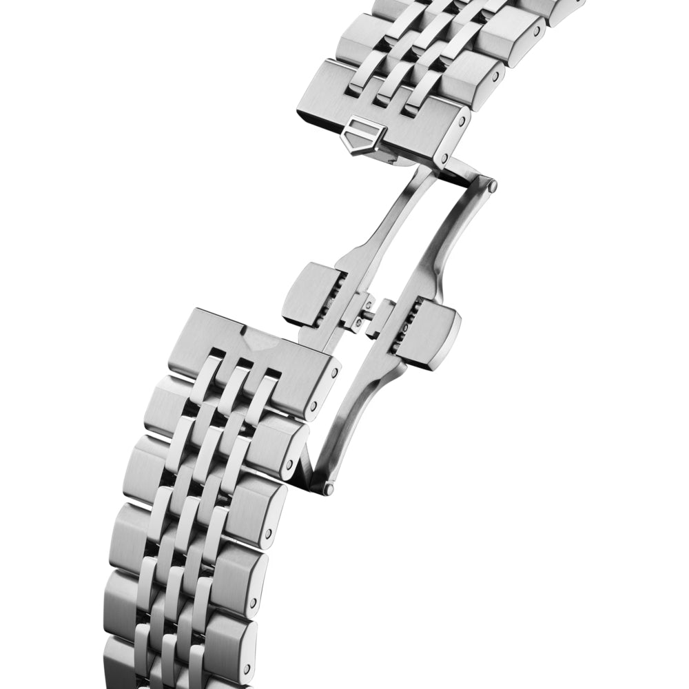 Close-up of a silver metal watch strap on a white background