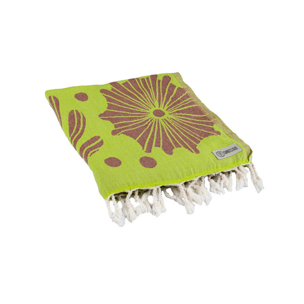 Green towel with brown shell pattern and white tassels on a white background.