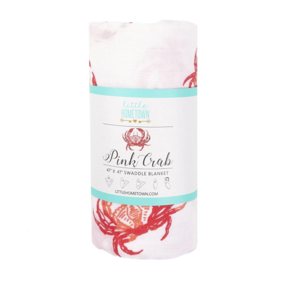 Swaddle blanket with pink crab design on a white background