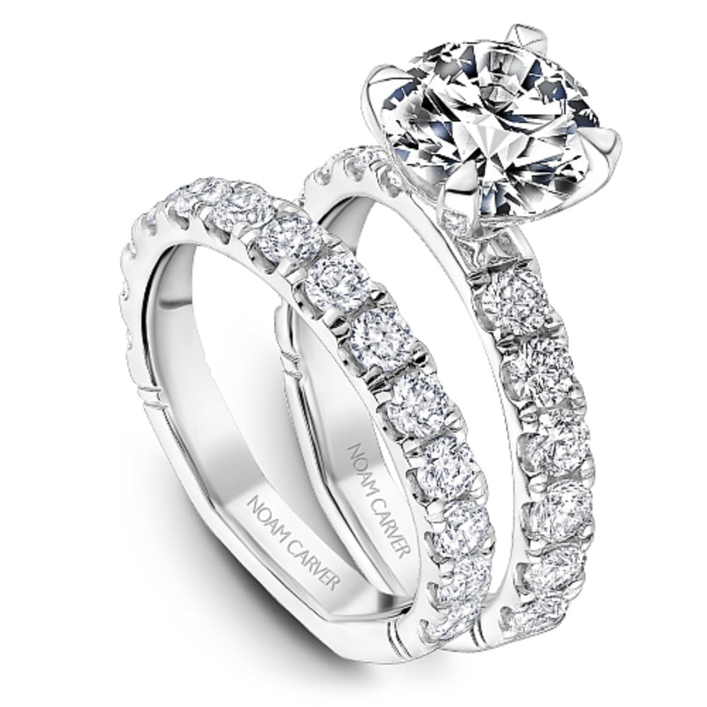 Diamond ring with 'Noam Carver' branding on a white background