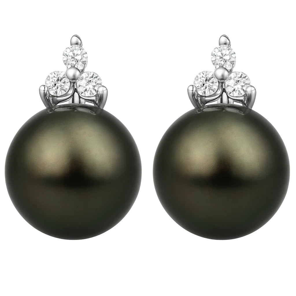Pair of black pearl earrings with diamond-like stone tops on a white background