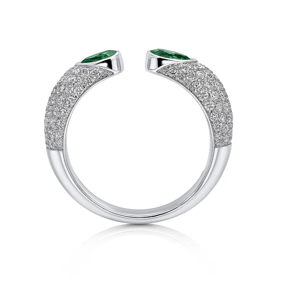 Silver ring with green gemstones on a white background
