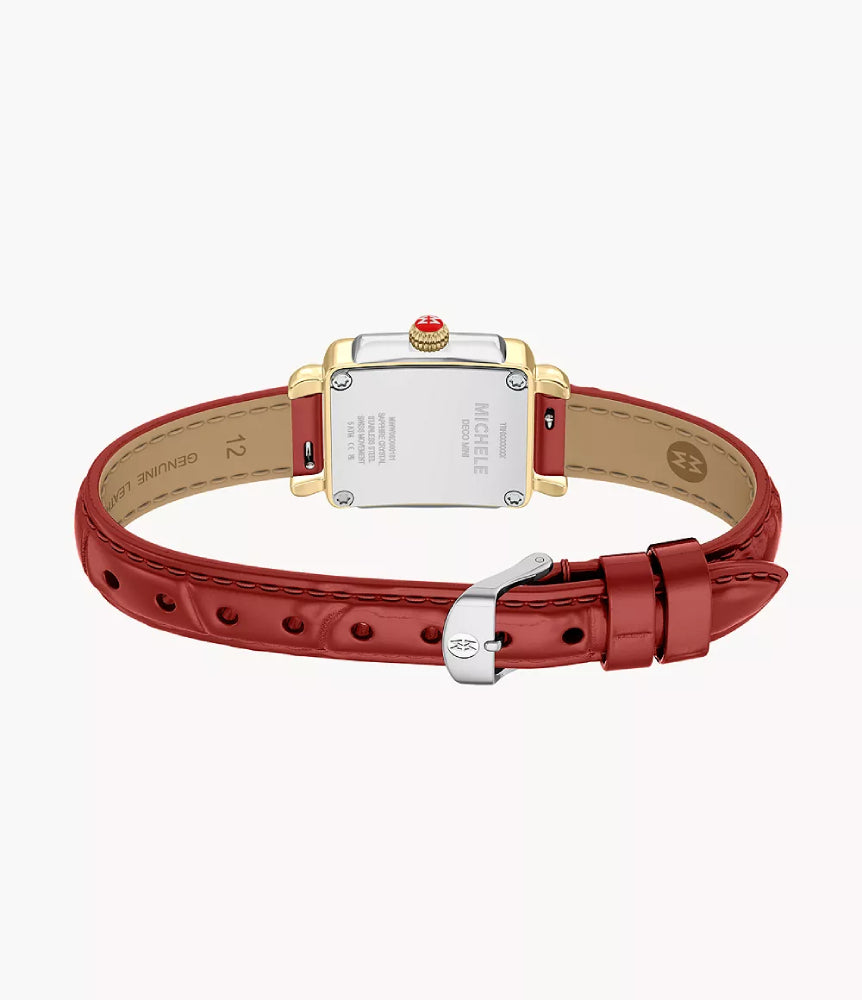 The back view of a MICHELE MONT LOUIS VUITTI watch with a red leather strap, gold-tone case, and silver-tone case back plate on a light gray background.