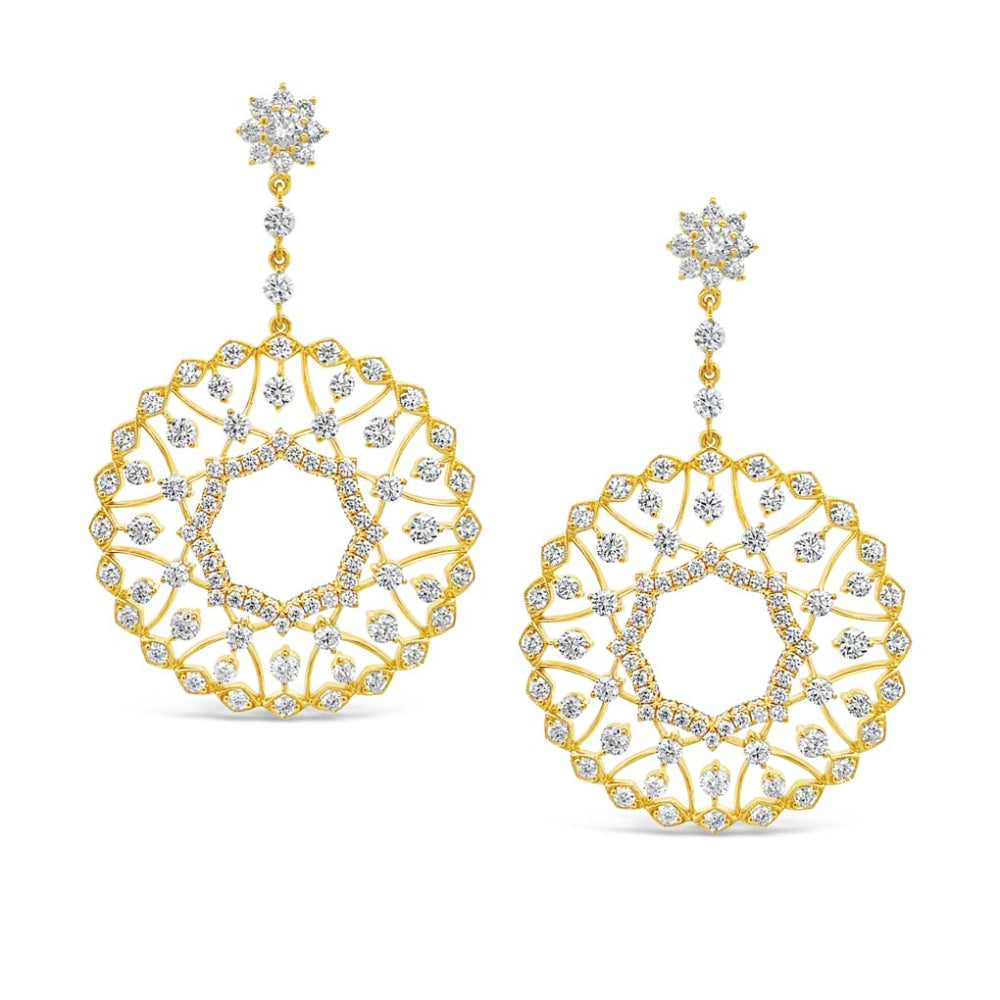 Yellow gold drop earrings with diamond accents on a white background