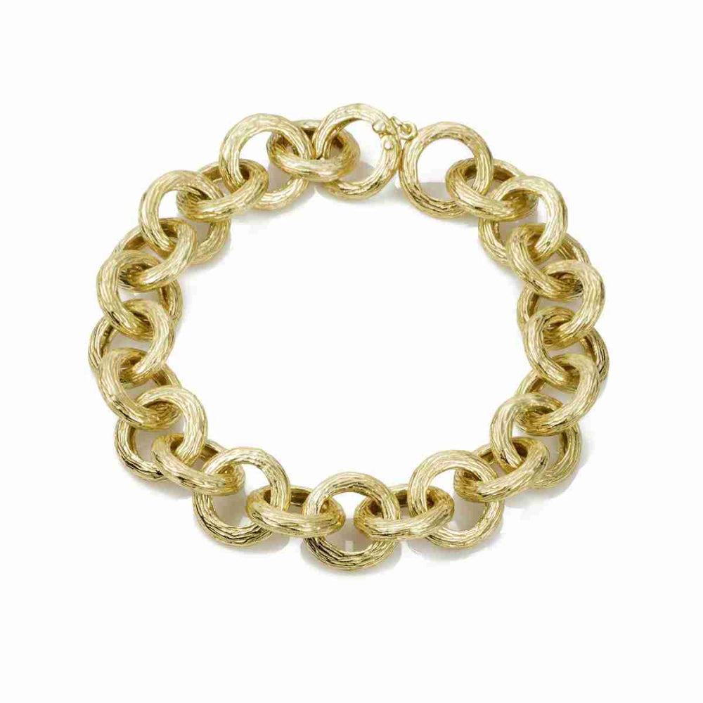 gold link bracelet on white background