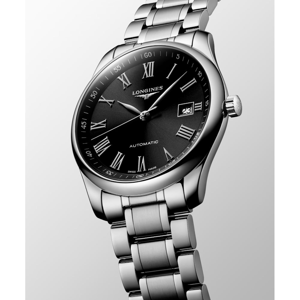 Silver wristwatch with black dial on a light gray background