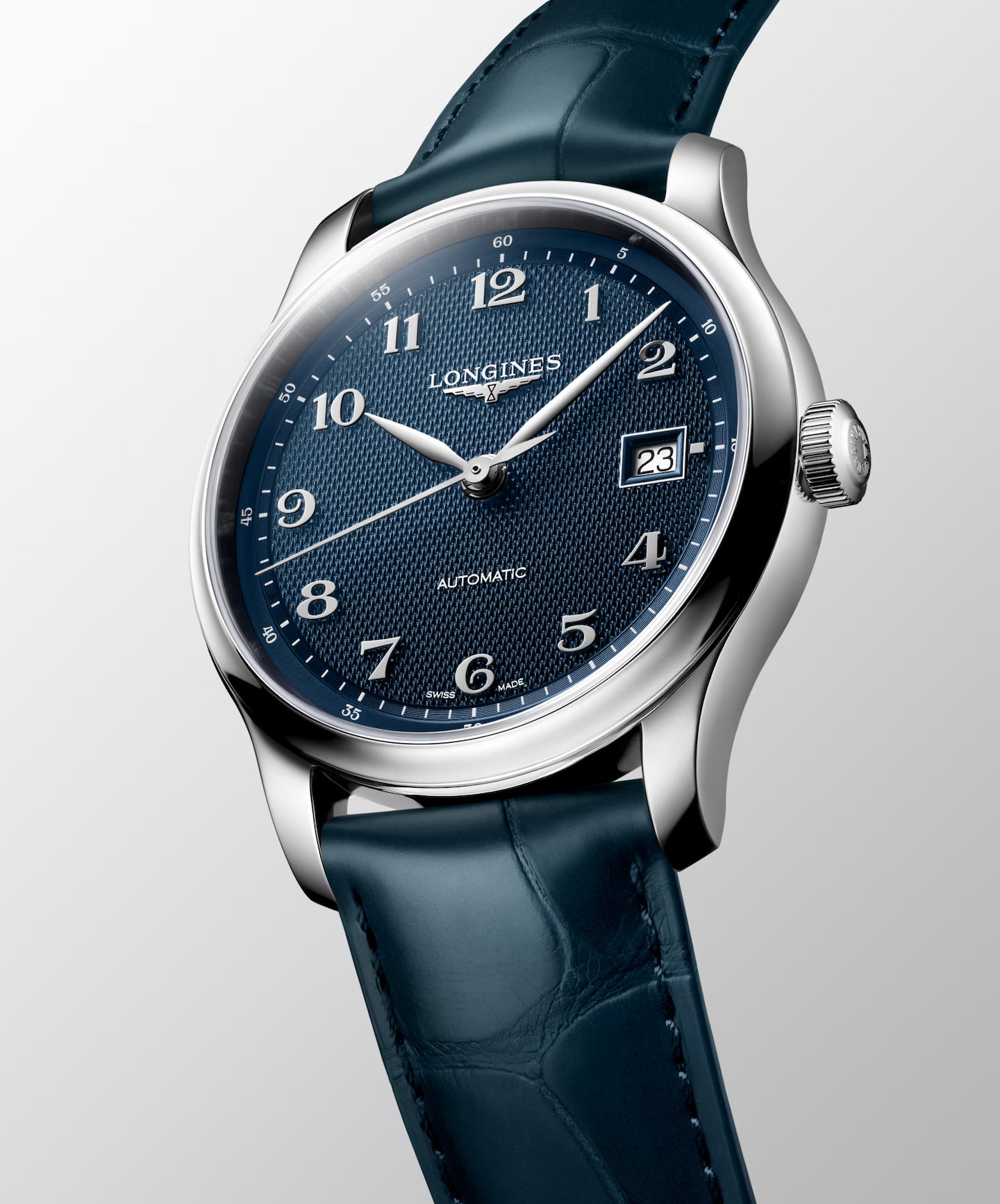 Longines watch with blue strap and face on a light gray background