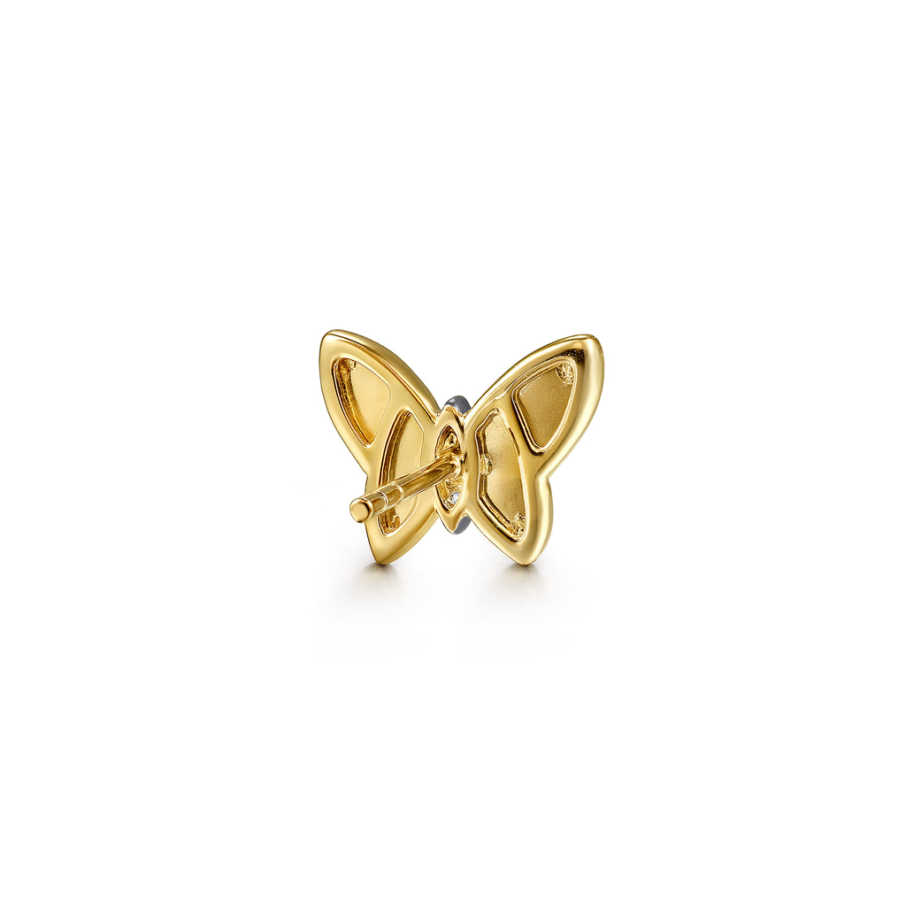 Gold butterfly earring on a white background