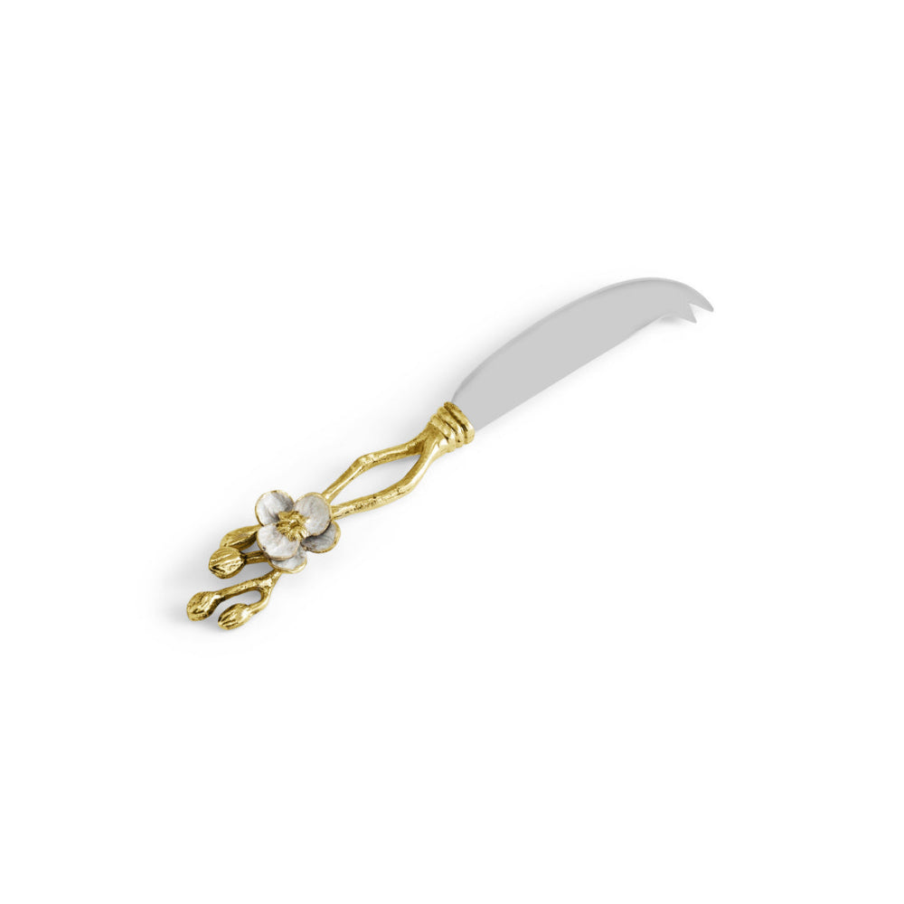 A knife with gold accents on a white background.