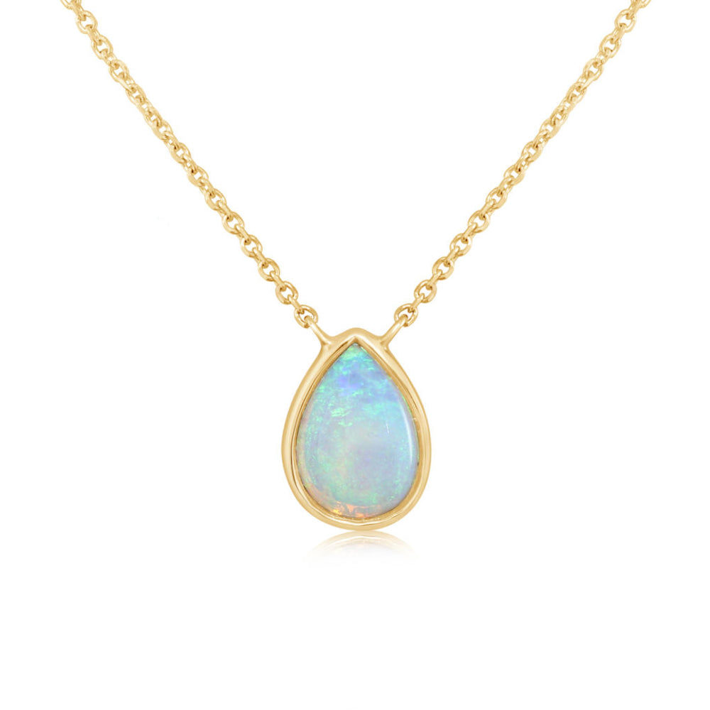 Gold necklace with a teardrop-shaped opal pendant on a white background