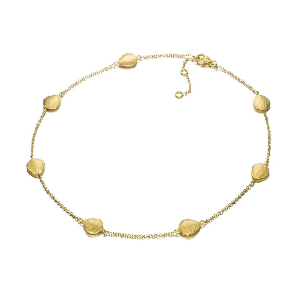 gold bead bracelet on white background