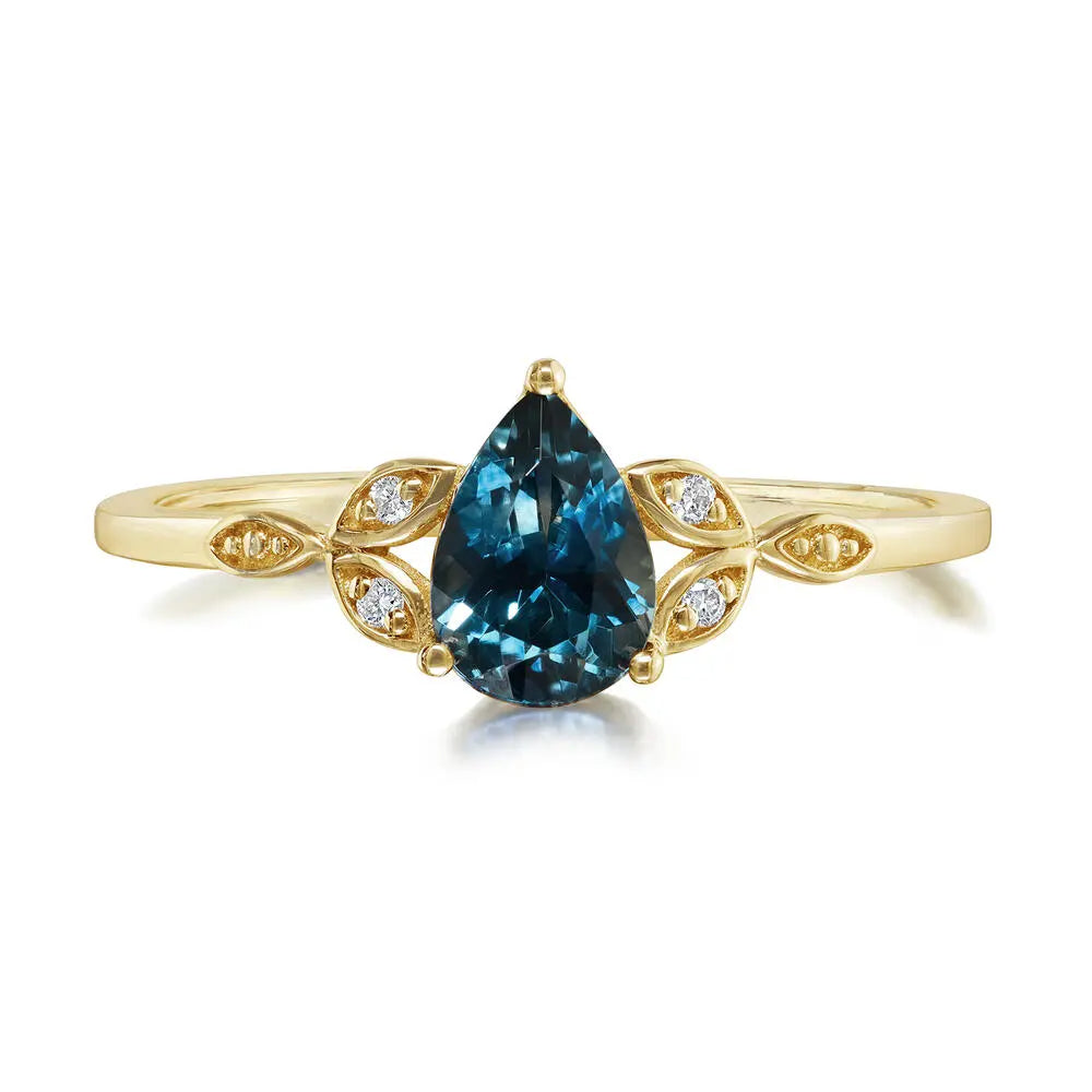 gold ring with blue sapphire on a white background
