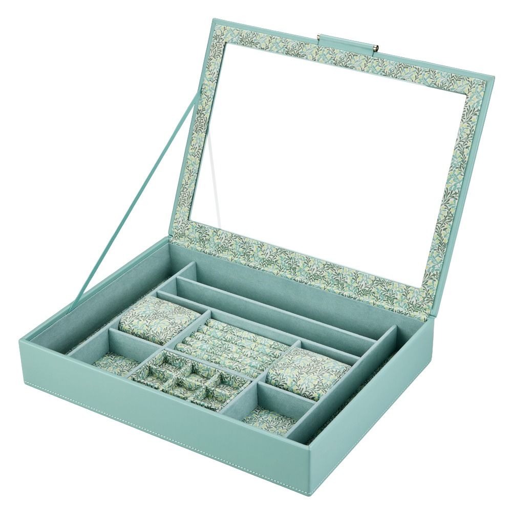 A light blue jewelry organizer box with a hinged glass lid, shown open to reveal multiple compartments and a floral-patterned interior lining.