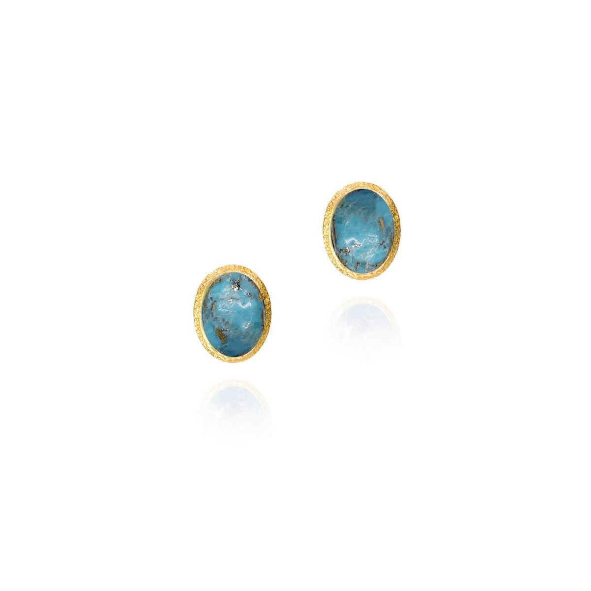blue stones in gold frames on white background