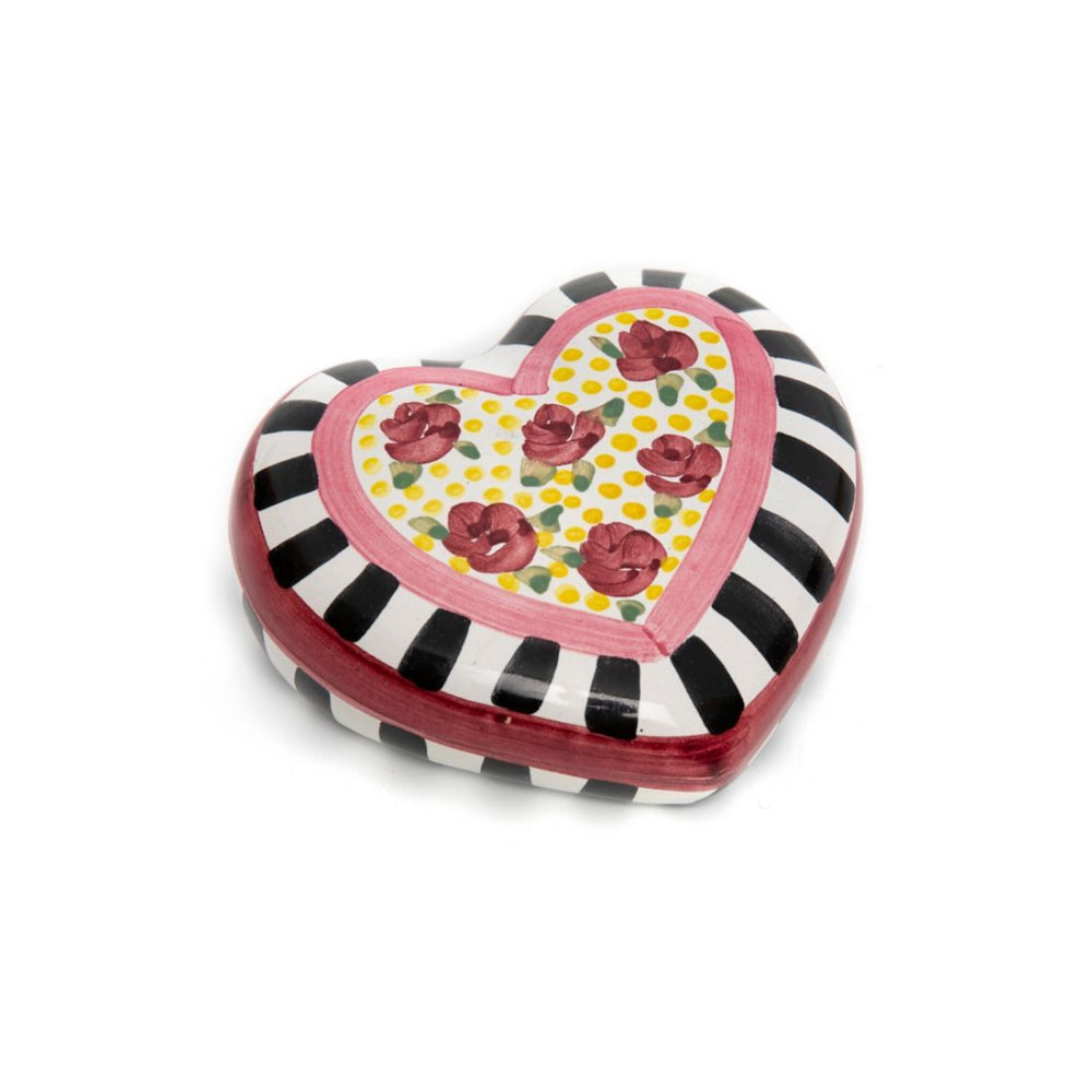 Heart-shaped decorative paperweight with black and white stripes and a pink rose floral design on a white background