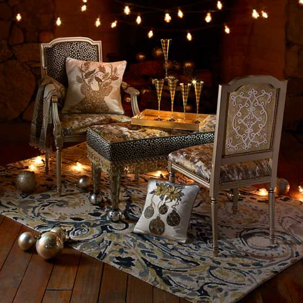Decorative bench with embellished top and gold fringe in a ornate room with gold furniture