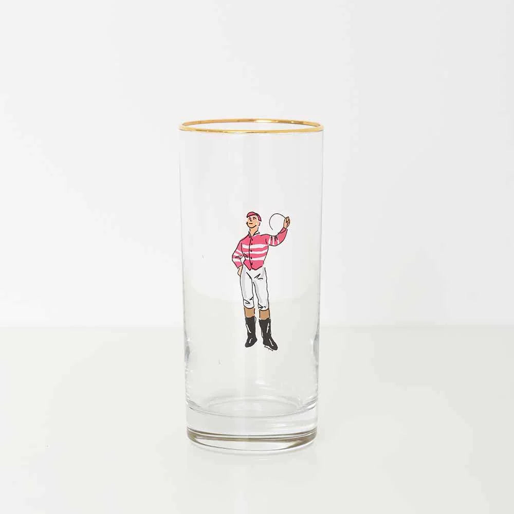 A bourbon glass with a pink jockey on a white background.