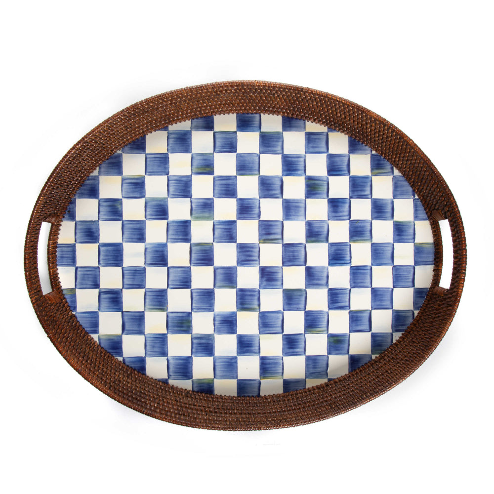 Oval-shaped tray with royal blue and white checkered pattern and brown woven rim on a white background