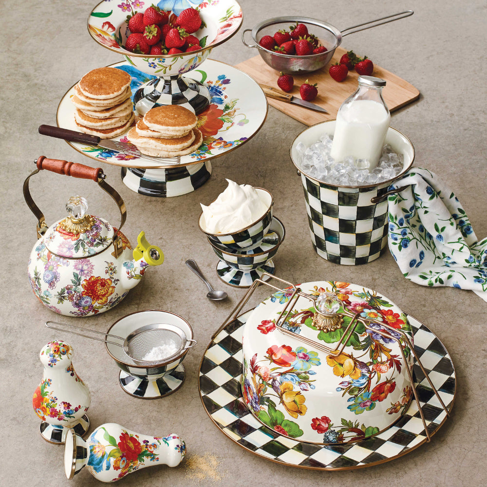 Decorative white teapot with colorful floral patterns and other mackenzie items