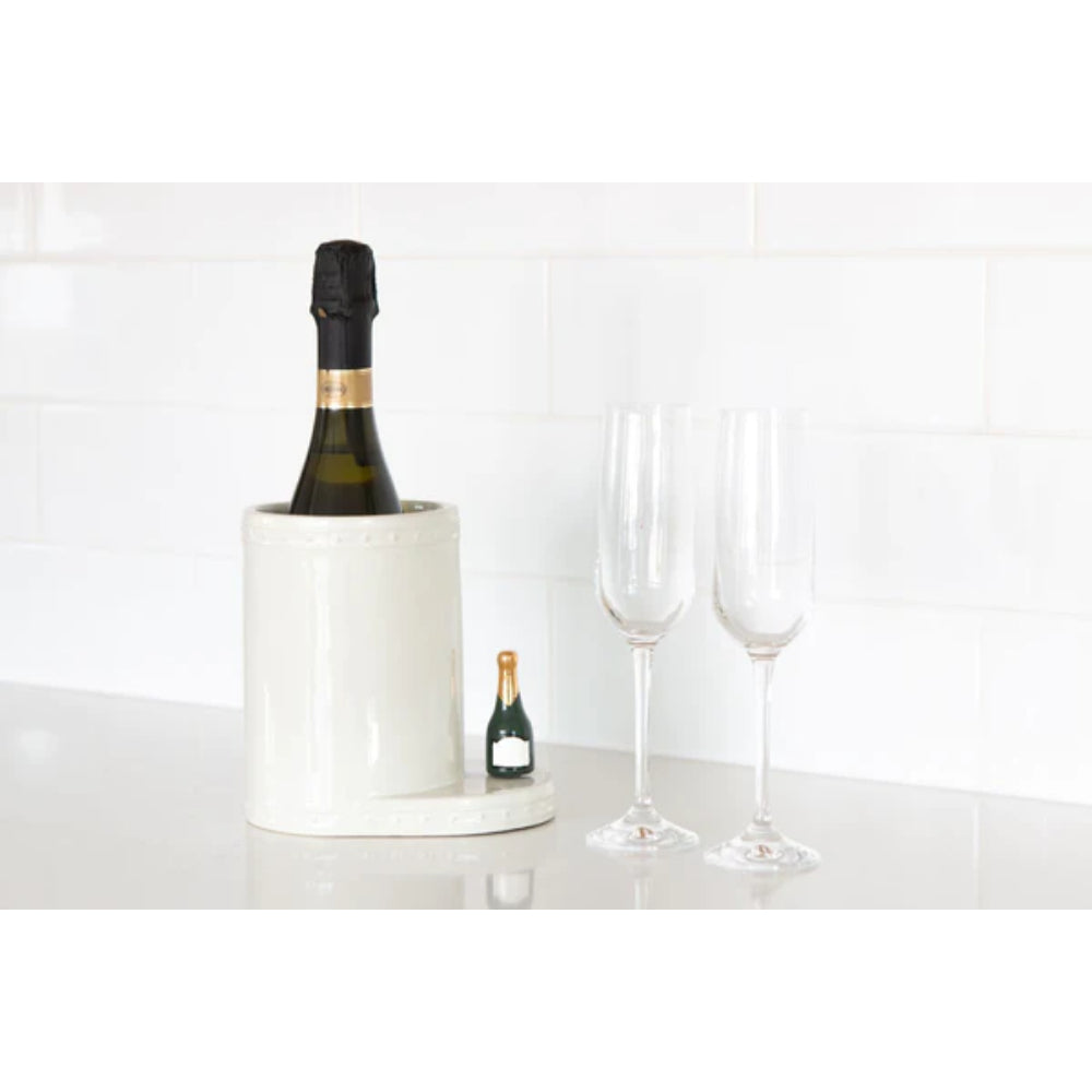 Decorative bottle-shaped mini on a white wine holder with wine glasses on a white backround