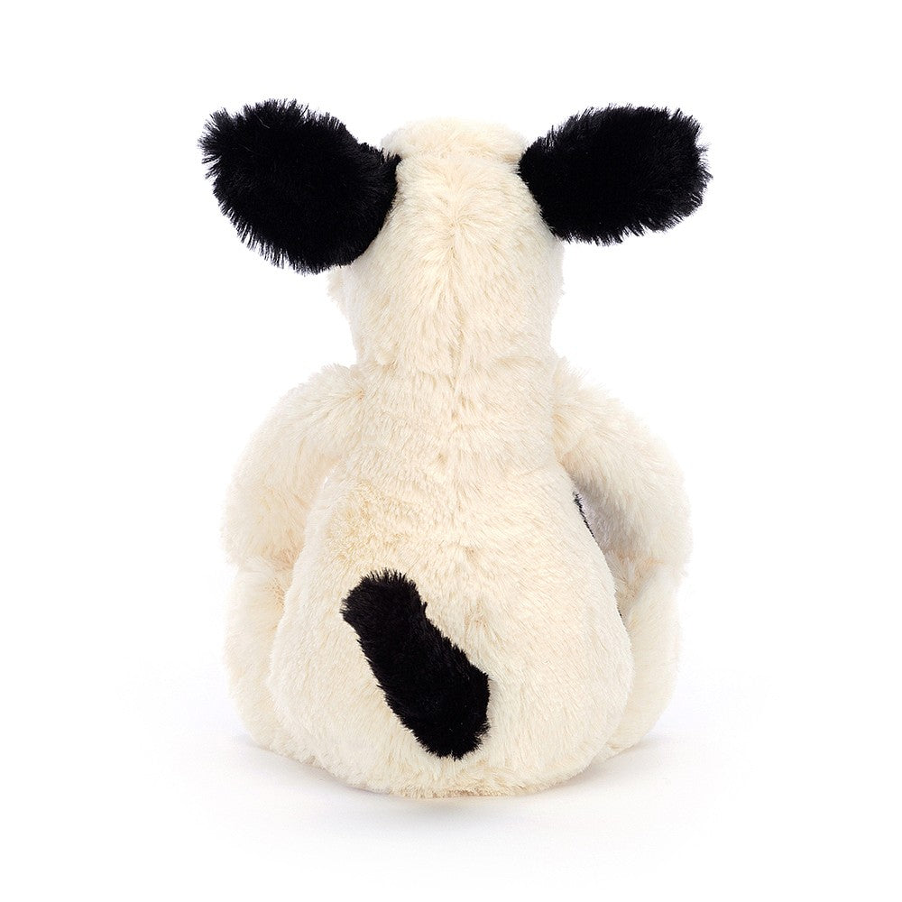 A back photo of the little size Jellycat Bashful Black and Cream Puppy on a white backround.
