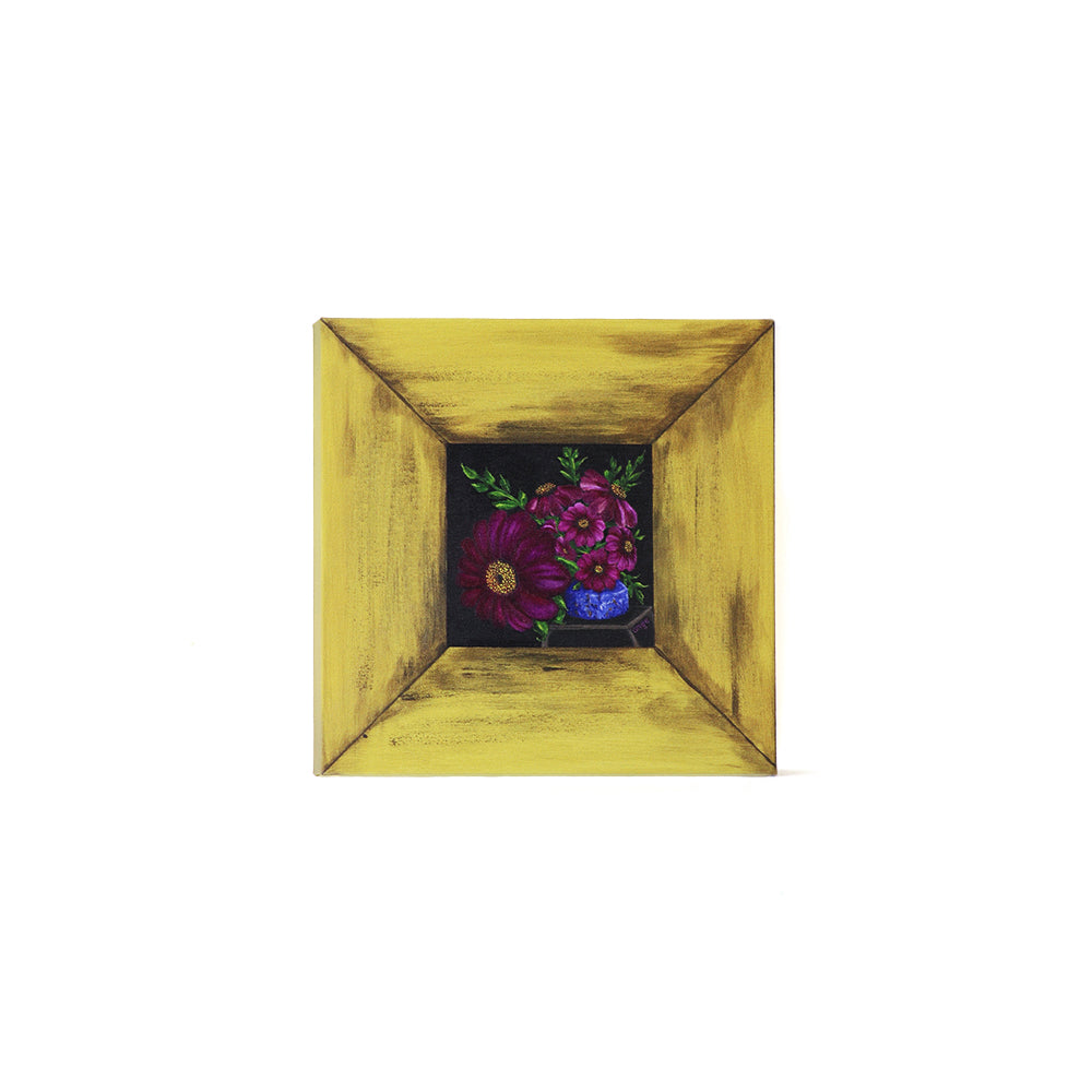 Small painting of colorful flowers in with a yellow wooden frame border on a white background.