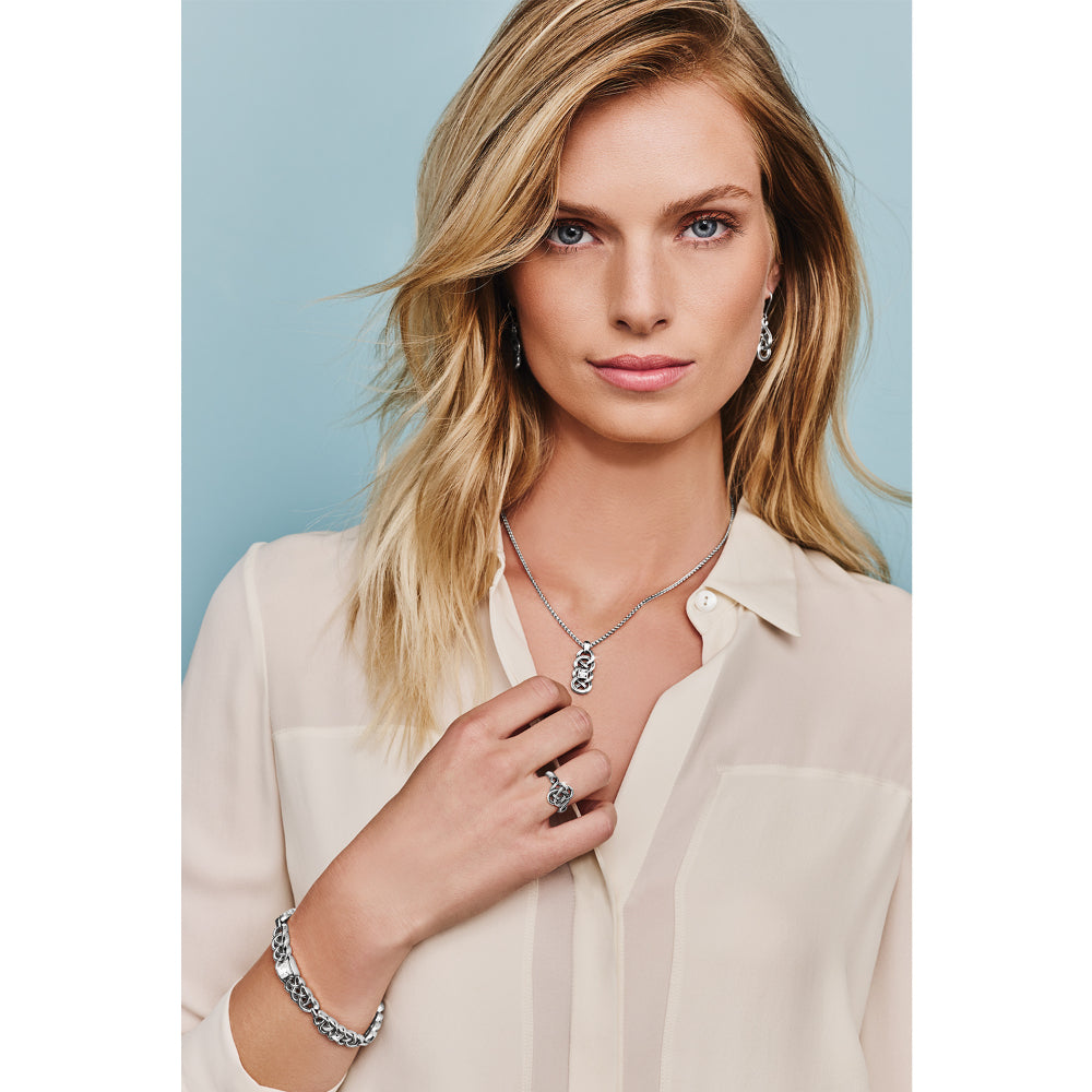 Silver earrings on model