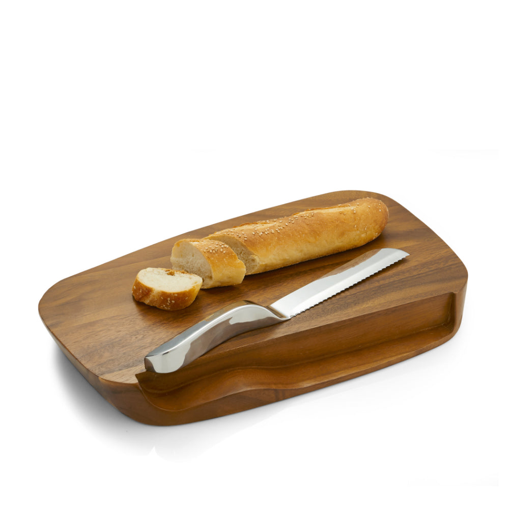 A wooden bread knife holder with a serrated knife with a cut up peice of bread on a white backround.
