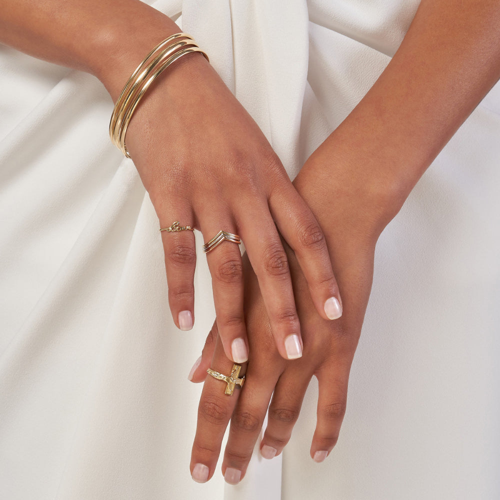 14 karat Yellow Gold 3.7mm stackable tube bangle bracelet
Arms showing stackable bracelets