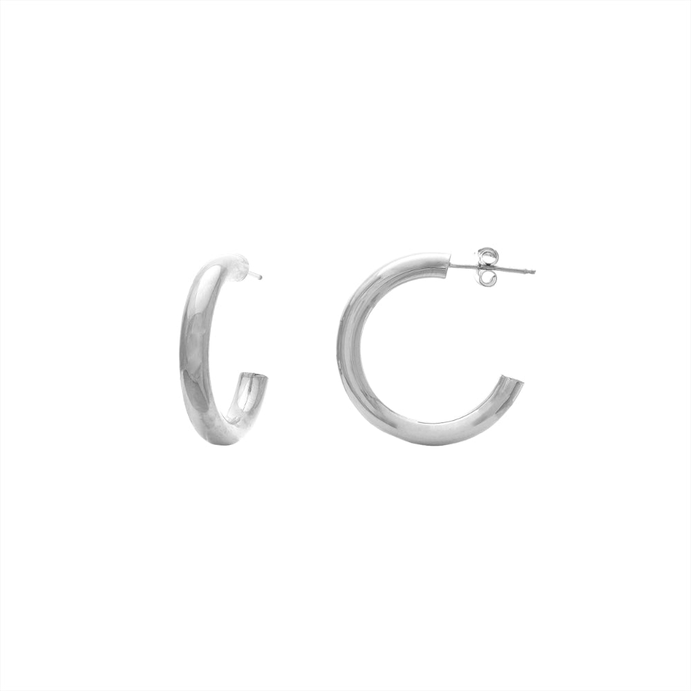 14 karat White Gold tube hoop earrings measure 4mm wide by 25mm in diameter.