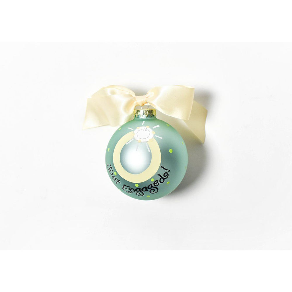 Just engaged ornament with yellow/gold tied bow for hanging and green color/polka dot design.