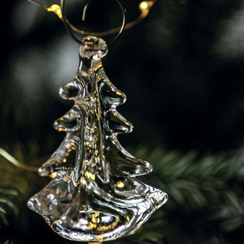 Decorative glass Christmas tree ornament on a dark background