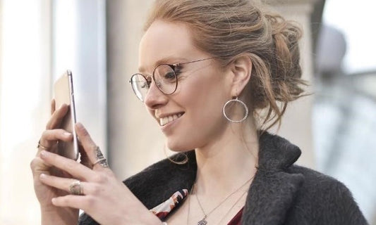 woman looking at phone screen